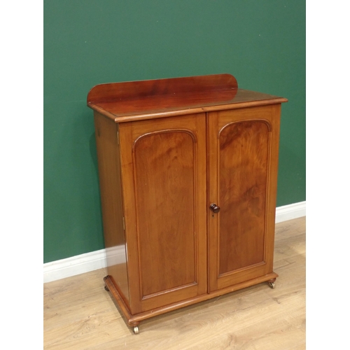 647 - A Victorian walnut Cupboard fitted pair of arched panel doors enclosing drawer and adjustable shelve... 