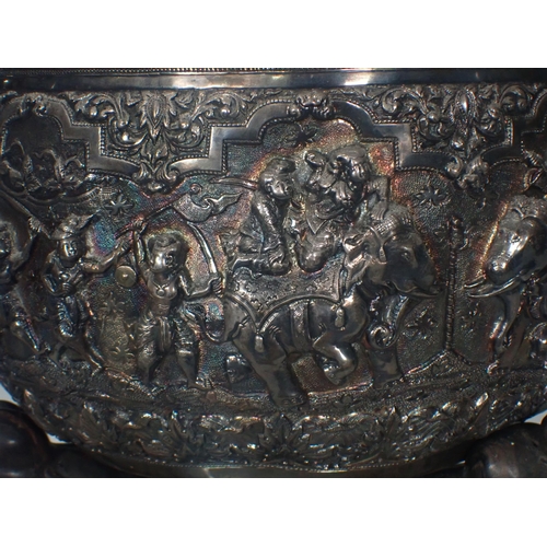 65 - A large 19th Century Burmese silver Thabeik Bowl, decorated with high relief repousse scene of mytho... 