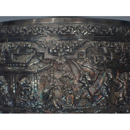 65 - A large 19th Century Burmese silver Thabeik Bowl, decorated with high relief repousse scene of mytho... 