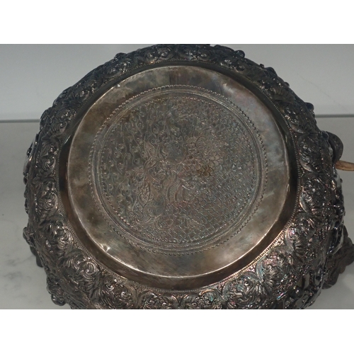 65 - A large 19th Century Burmese silver Thabeik Bowl, decorated with high relief repousse scene of mytho... 