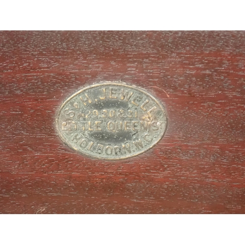 655 - An Edwardian mahogany Bedside Stand bearing retailers label  