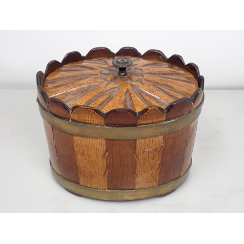 664 - A 19th Century Scottish oval brass bound lidded Box and cover, in bands of mixed woods with feathere... 