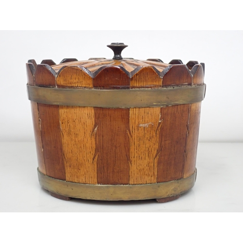 664 - A 19th Century Scottish oval brass bound lidded Box and cover, in bands of mixed woods with feathere... 