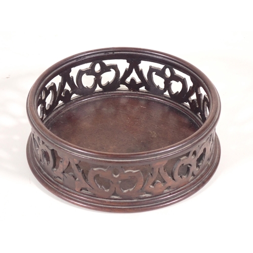 666 - A pair of mahogany pierced circular Wine Coasters A/F.