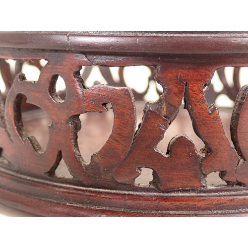 666 - A pair of mahogany pierced circular Wine Coasters A/F.