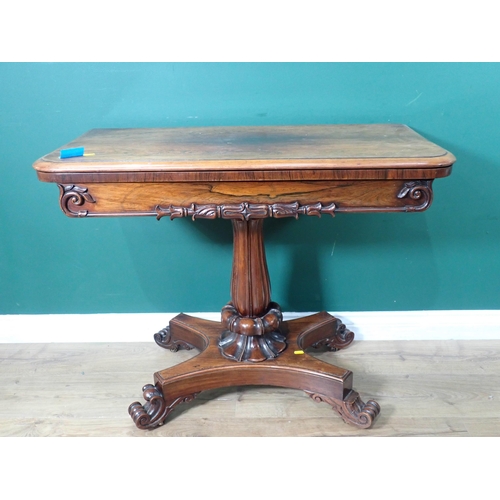 667 - A William IV rosewood fold-over Card Table on baluster turned column and platform base and scroll fe... 