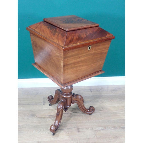 682 - An early Victorian mahogany Teapoy of sarcophagus shape, the hinged lids enclosing pair of lidded bo... 