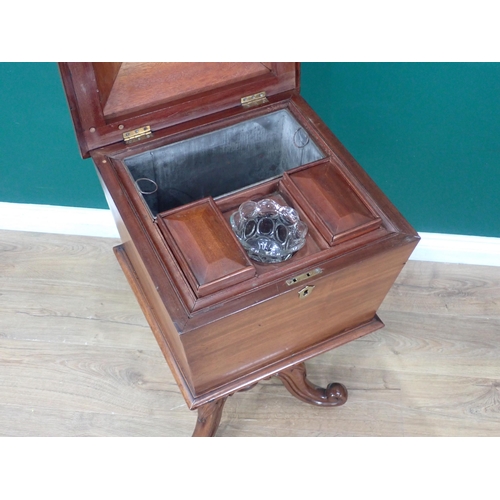 682 - An early Victorian mahogany Teapoy of sarcophagus shape, the hinged lids enclosing pair of lidded bo... 