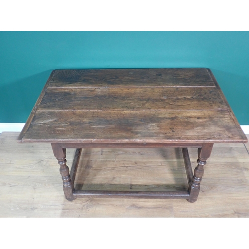 685 - An antique elm top Table with three plank cleated top on associated base with baluster turned suppor... 