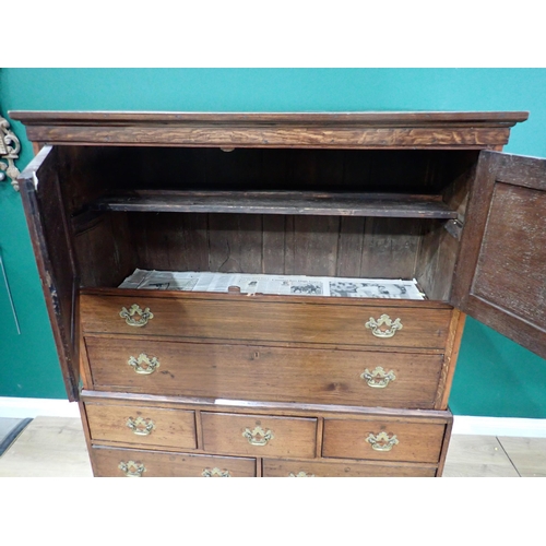 689 - A Georgian and later oak Cupboard on stand, having moulded cornice above pair of solid panel doors e... 