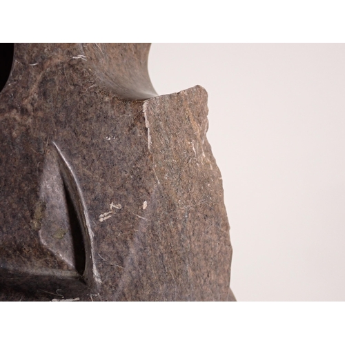 693 - A large Inuit hardstone Carving of a figure in stylised form with pierced and carved detail, 2ft 9in