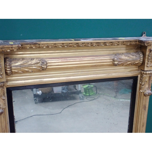 707 - A Regency gilt Wall Mirror, the mirror plate surrounded by a gilt slip flanked by reeded and acanthu... 