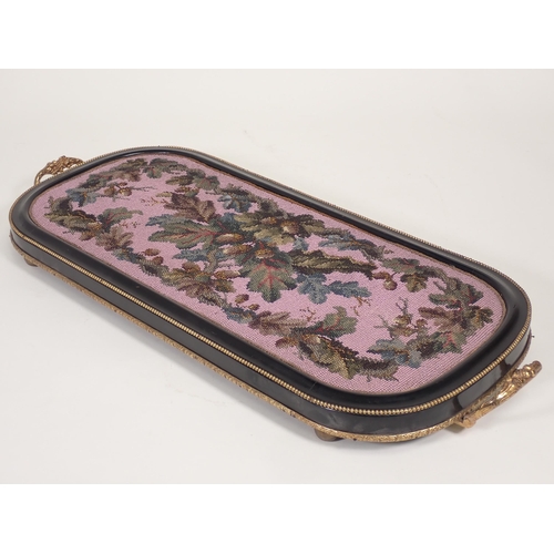 711 - A 19th Century beadwork Tray with ebonised and beaded frame and two gilt metal handles 2ft W