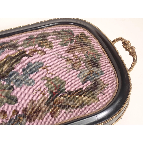 711 - A 19th Century beadwork Tray with ebonised and beaded frame and two gilt metal handles 2ft W