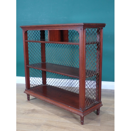 717 - A Regency mahogany Bookcase with wirework lattice ends and fixed shelves on turned supports 2ft 8in ... 