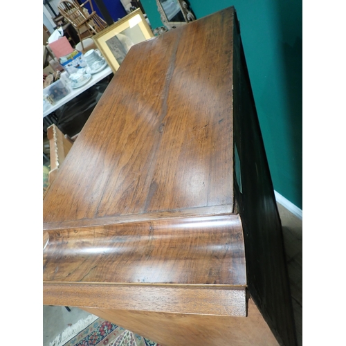 730 - A 19th Century Biedermeier Chest in walnut with shaped surmount above seven crossbanded graduated dr... 