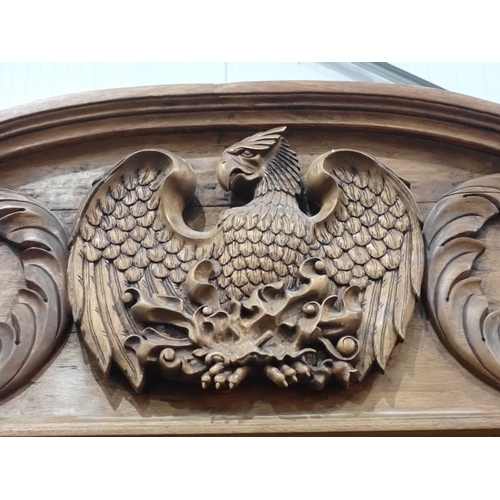 731 - A large bespoke made half-tester Bed bearing carved coat of arms to the panelled back flanked by car... 