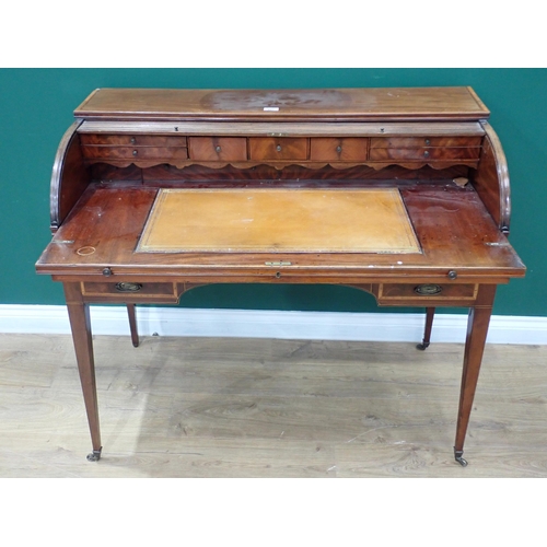 732 - A 19th Century mahogany tambour-fronted Desk with fitted interior and inset writing surface above an... 