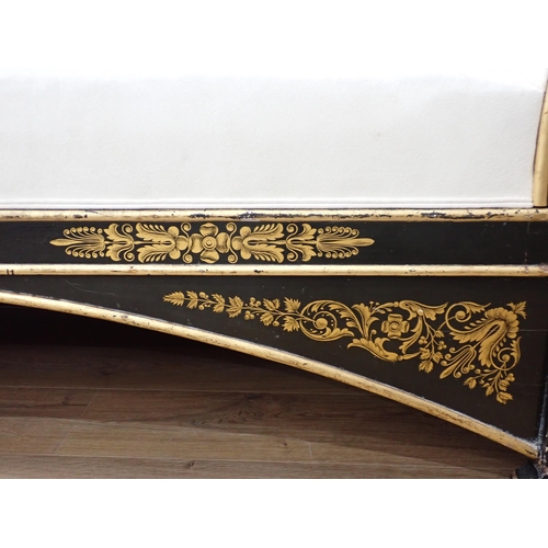 735 - A Regency style large Sofa with ebonised frame painted dolphins in gilt and with floral motifs, 7ft ... 