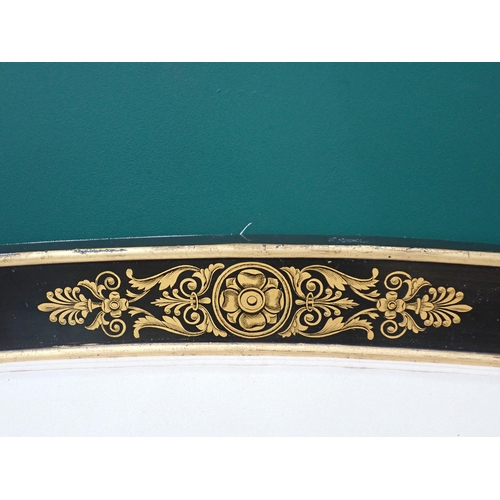 735 - A Regency style large Sofa with ebonised frame painted dolphins in gilt and with floral motifs, 7ft ... 