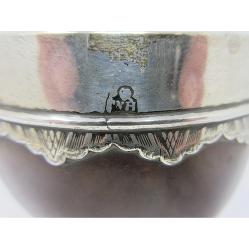 80 - An early silver mounted Coconut Cup with shallow engraved frieze to the rim, engraved initials, 6in,... 