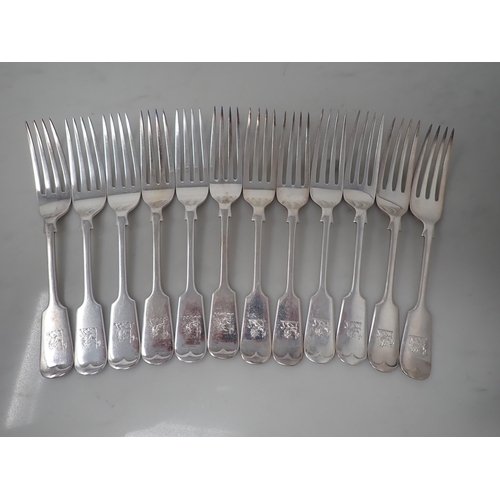 94 - An extensive Canteen of Victorian silver Cutlery, fiddle pattern engraved crest, Sheffield 1884/6, m... 