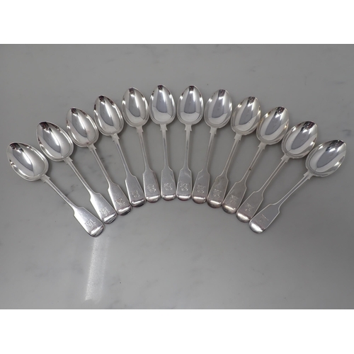 94 - An extensive Canteen of Victorian silver Cutlery, fiddle pattern engraved crest, Sheffield 1884/6, m... 