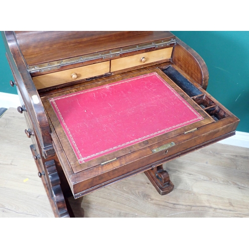 678 - A 19th Century walnut Davenport fitted four side drawers with sliding writing surface and rise and f... 