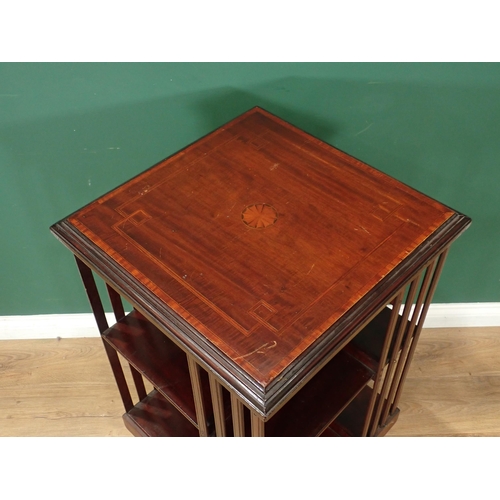 691 - An Edwardian mahogany cross-banded and inlaid rotating Bookcase, of square form and with four uprigh... 