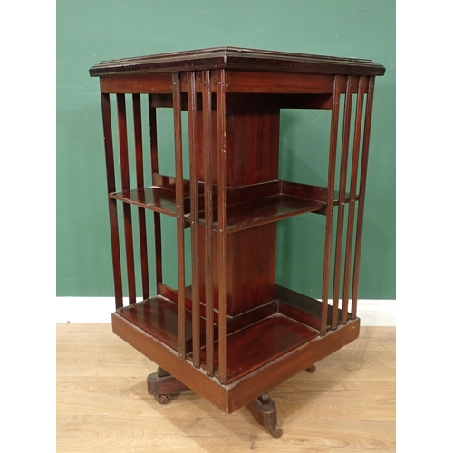 691 - An Edwardian mahogany cross-banded and inlaid rotating Bookcase, of square form and with four uprigh... 