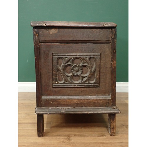 567 - A 17th Century oak Coffer with sunken two panel lid above two earlier tracery carved rosette front p... 