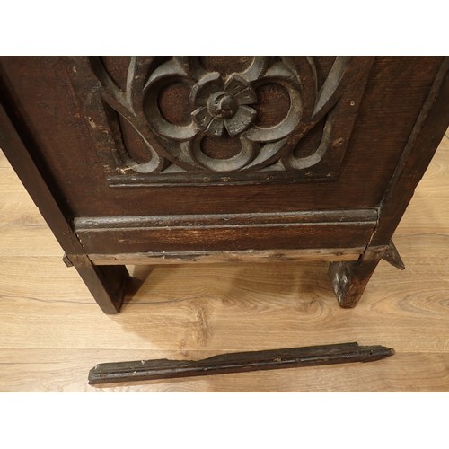 567 - A 17th Century oak Coffer with sunken two panel lid above two earlier tracery carved rosette front p... 