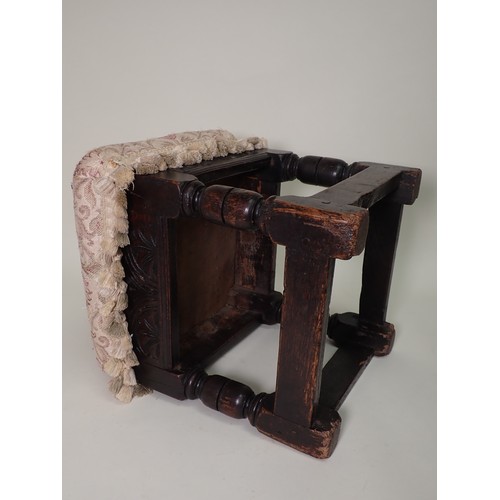 574 - A Charles II, c.1680 joined oak Stool with later upholstered top above leafage carved arcaded frieze... 