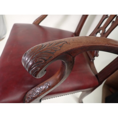 615 - A George III mahogany Elbow Chair in the Chippendale style with leafage carving and leather seat mou... 