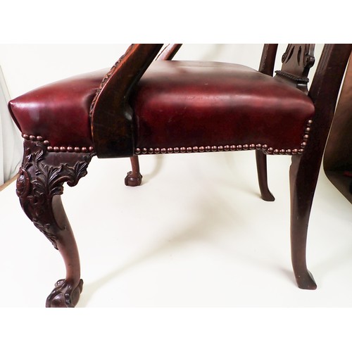 615 - A George III mahogany Elbow Chair in the Chippendale style with leafage carving and leather seat mou... 