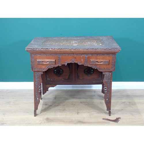 626 - An Anglo Indian Travel Desk with finely carved detail to the top, fitted two small frieze drawers, t... 