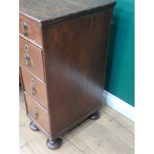 637 - An 18th Century oak Kneehole Desk, the arched recess with cupboard surrounded by seven drawers, on l... 