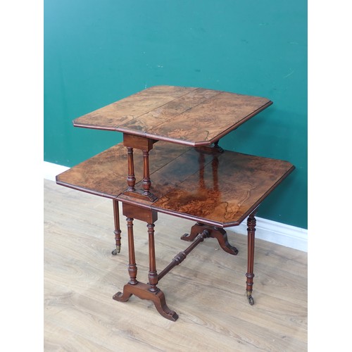 616 - A Victorian figured walnut two tier Sutherland Table mounted on turned supports and square cut feet ... 