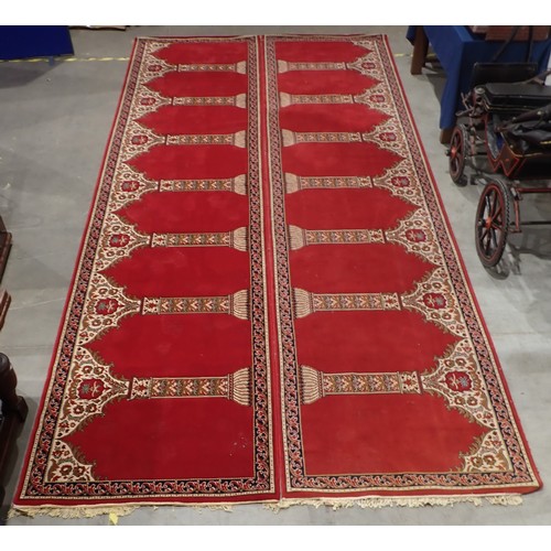 505A - A pair of long red ground Runners with design of repeating floral pillars, 17ft 8in L x 4ft1in W