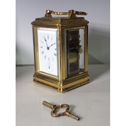 531 - A brass repeating Alarm Carriage Clock with white enamel dial, Roman numerals and alarm subsidiary d... 