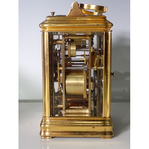 531 - A brass repeating Alarm Carriage Clock with white enamel dial, Roman numerals and alarm subsidiary d... 