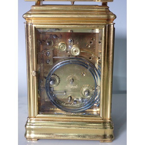 531 - A brass repeating Alarm Carriage Clock with white enamel dial, Roman numerals and alarm subsidiary d... 