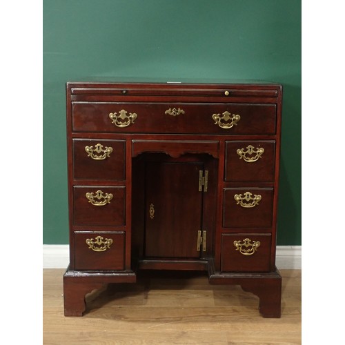 703 - An early Georgian style mahogany kneehole Desk, with caddy top and fitted slide above frieze drawer,... 