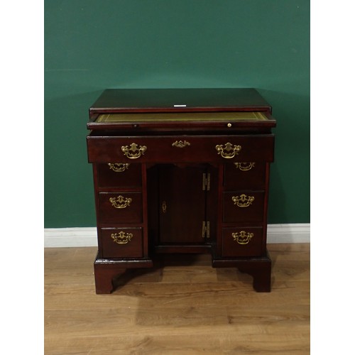 703 - An early Georgian style mahogany kneehole Desk, with caddy top and fitted slide above frieze drawer,... 