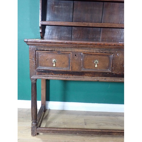 704 - A late 17th/early 18th Century and later oak Dresser, the plate rack with moulded cornice and three ... 