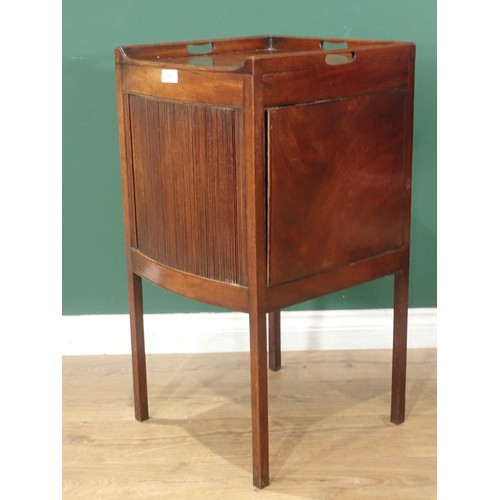 713 - A Georgian mahogany bow front Bedside Cabinet, the tray top with three handles and with sliding tamb... 