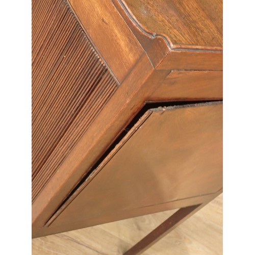 713 - A Georgian mahogany bow front Bedside Cabinet, the tray top with three handles and with sliding tamb... 