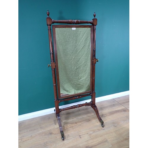 714 - A Regency mahogany Cheval Mirror, the rectangular plate in reeded frame and suspended between turned... 