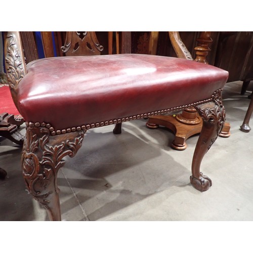 615 - A George III mahogany Elbow Chair in the Chippendale style with leafage carving and leather seat mou... 