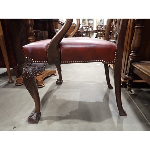 615 - A George III mahogany Elbow Chair in the Chippendale style with leafage carving and leather seat mou... 